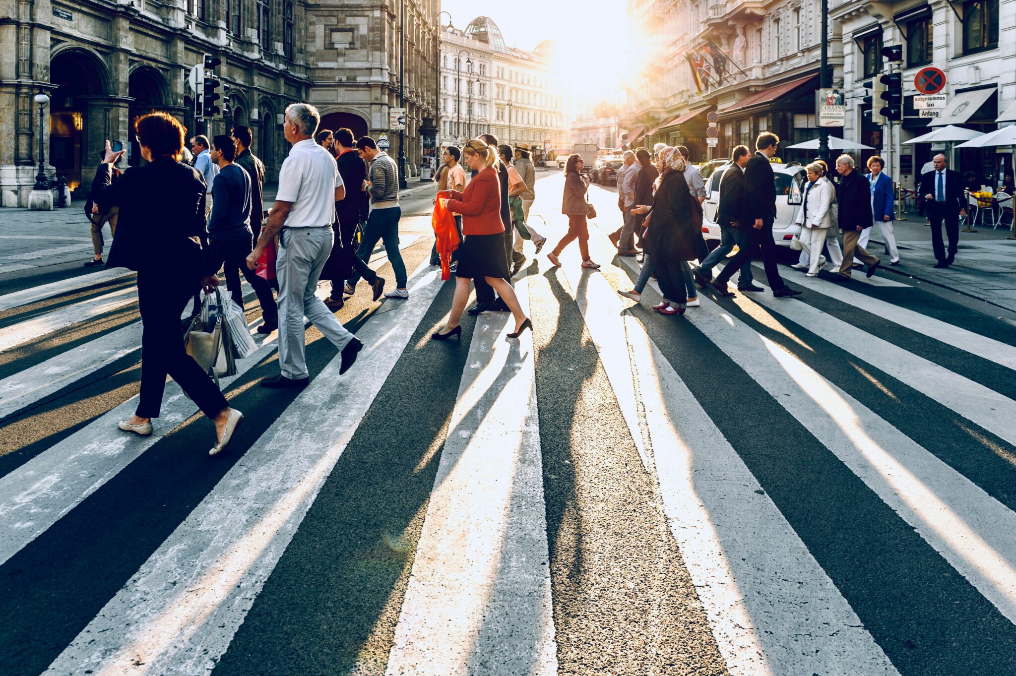 Photo of people walking across a crosswalk
